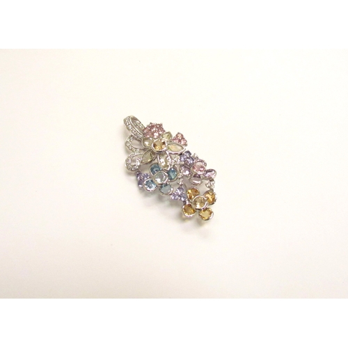 9158 - A white gold multiple stone flower cluster pendant/brooch, comprising of multi-coloured quartz, topa... 