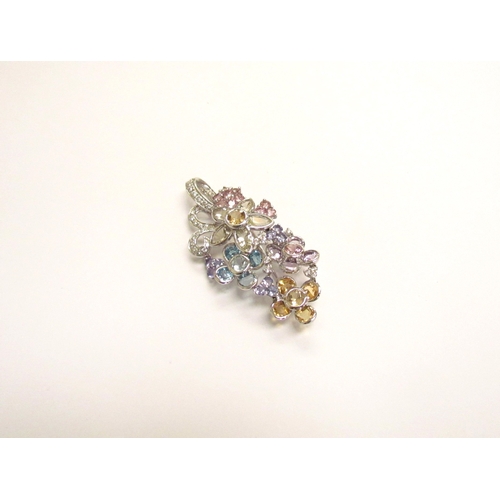 9158 - A white gold multiple stone flower cluster pendant/brooch, comprising of multi-coloured quartz, topa... 