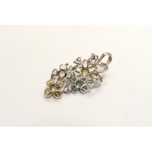 9158 - A white gold multiple stone flower cluster pendant/brooch, comprising of multi-coloured quartz, topa... 