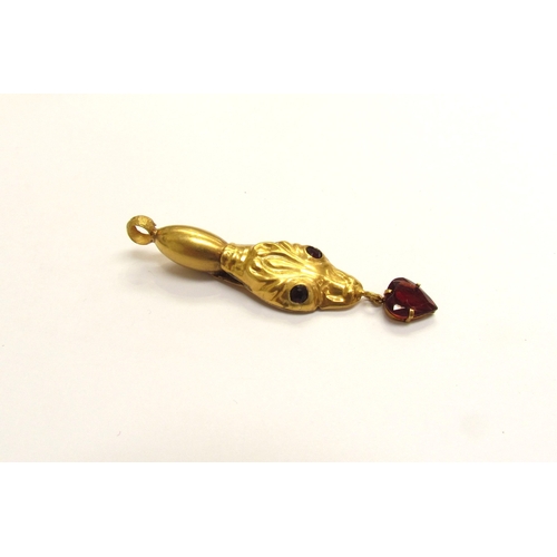 9154 - A gold snake head pendant with garnet set eyes and heart shaped garnet drop, marked c18, 4.1g