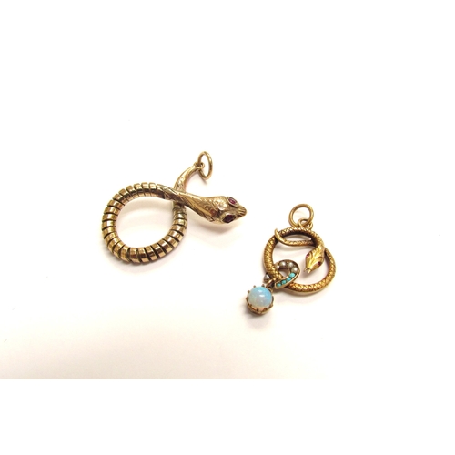 9152 - A 9ct gold coiled snake pendant, with ruby set eyes and another of a coiled snake with a turquoise a... 