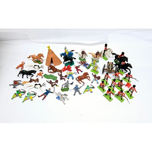 7203 - A mixed lot of mostly Britains Deetail plastic figures including Redcoats, Native Americans, knights... 