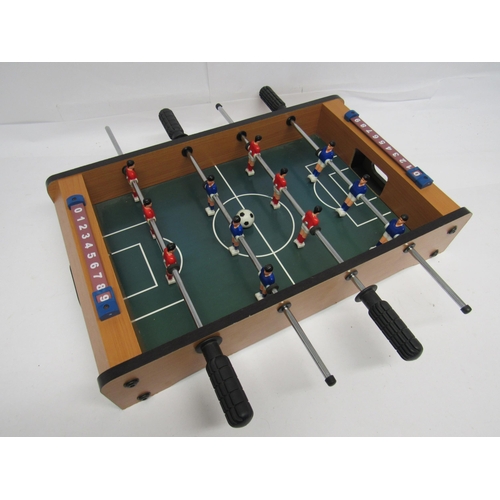 7183 - A small table top football game, 51cm long