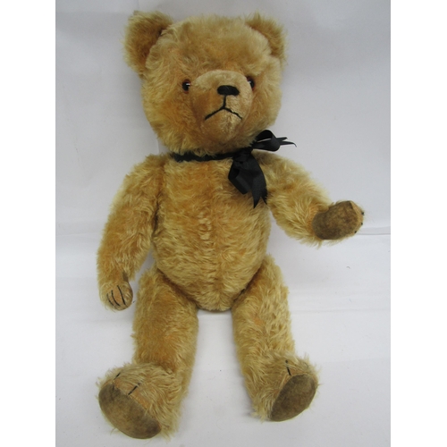 7116 - A straw filled golden mohair teddy bear with plastic eyes, stitched nose, mouth and claws, articulat... 