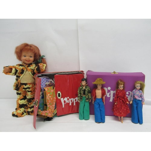 7157 - Four Palitoy Pippa and Pete fashion dolls and an assortment of clothing, housed within two Pippa car... 