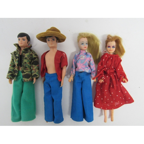 7157 - Four Palitoy Pippa and Pete fashion dolls and an assortment of clothing, housed within two Pippa car... 