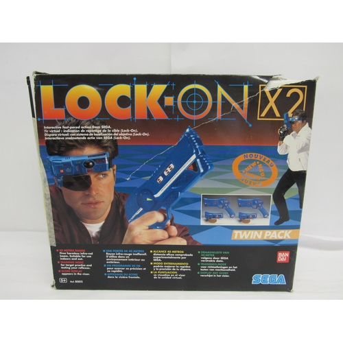 7010 - A boxed Sega Lock-On X2 infra-red laser tag game (box a/f)