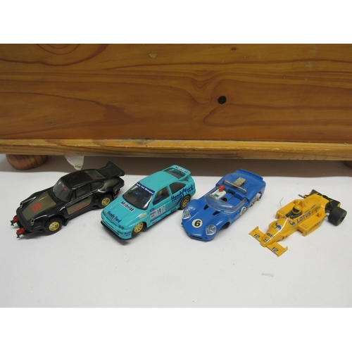 7206 - A wooden chest containing four heavily playworn Scalextric slot racing cars, two hand throttles and ... 