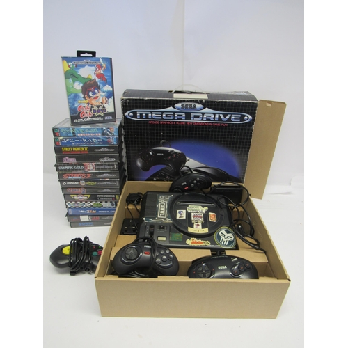 7001 - A boxed Sega Mega Drive 16-bit computer game console with three Sega controllers, Beeshii Striker co... 