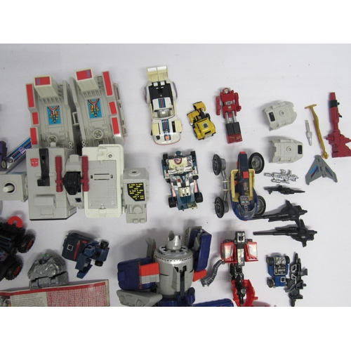 7019 - A collection of Vintage playworn Transformers and similar vehicles, figures, accessories and spares