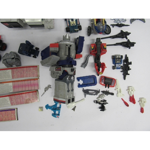 7019 - A collection of Vintage playworn Transformers and similar vehicles, figures, accessories and spares