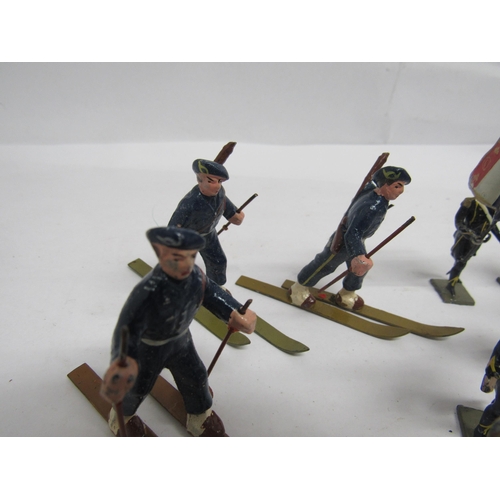 7198 - A collection of CBG Mignot, Quiralu and other lead figures including skiers, military bandsmen, rifl... 