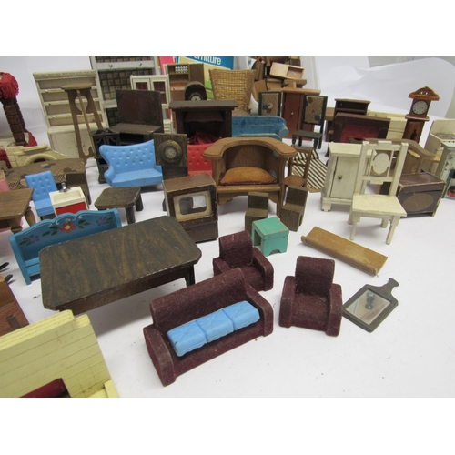 7143 - A collection of wooden, metal and plastic dolls house furniture, including boxed Triang Spot-On hamm... 