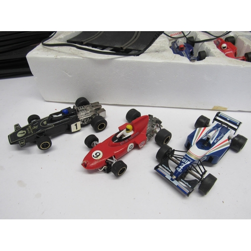 7047 - A Scalextric Grand Prix Bridgestone F1 V Minolta F1 slot racing set, together with three additional ... 