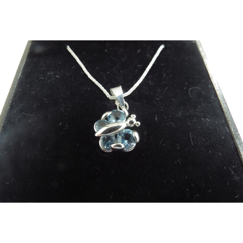 9392 - A 9ct white gold chain, 40cm long hung with a blue topaz butterfly pendant, 4.3g and a 9ct white gol... 