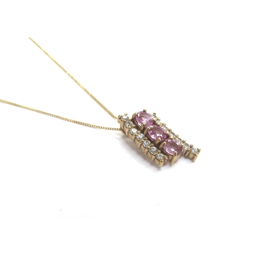 9391 - A 9ct gold chain, 44cm long hung with a pink sapphire and white stone pendant, 4g      (E) £60-100