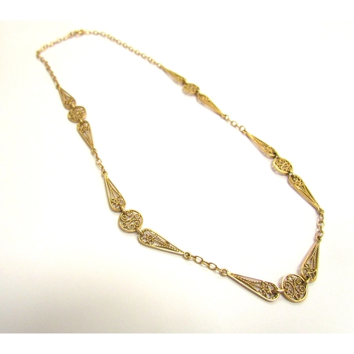 9066 - A gold necklace with chain and filigree links, unmarked, 45cm long, 13.9g