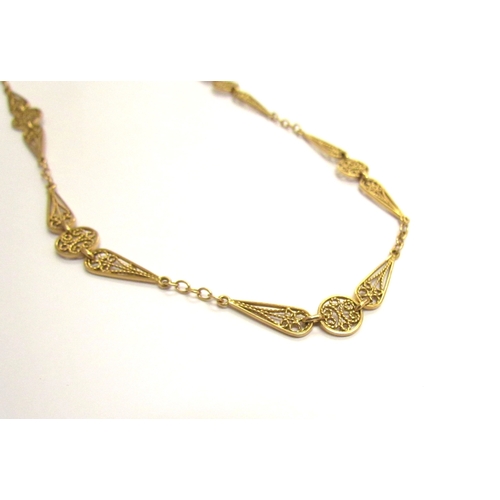 9066 - A gold necklace with chain and filigree links, unmarked, 45cm long, 13.9g