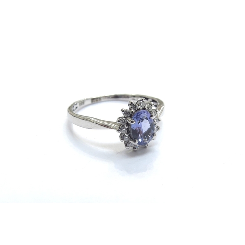 9379 - A Tanzanite and diamond cluster ring, stamped 585. Size N/O, 2g     (E) £200-300