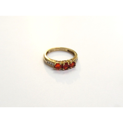 9121 - A 9ct gold fire opal and diamond ring. Size J, 1.7g