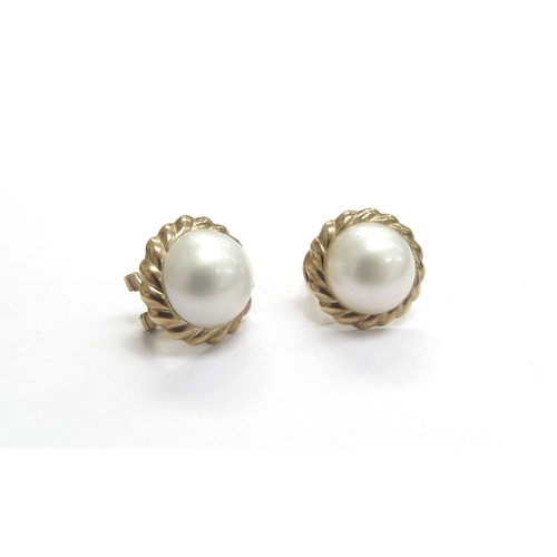 9367 - A pair of 9ct gold Mabe pearl earrings, omega clasps, 1.7cm diameter, 5.3g