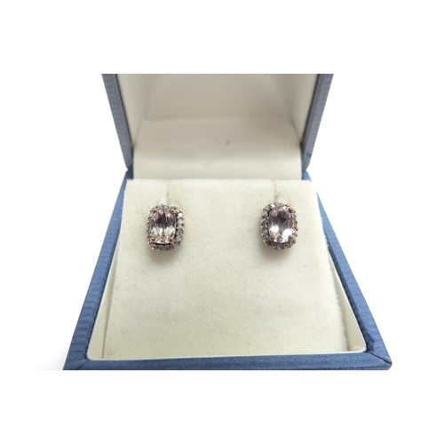 9322 - A pair of gold morganite and diamond cluster earrings, stamped 9k, 1.4g