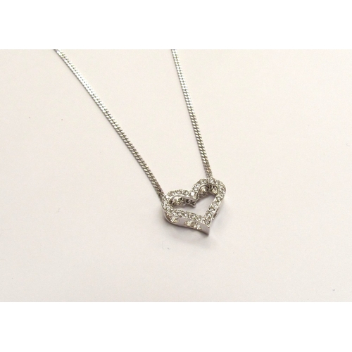 9292 - An 18ct white gold diamond heart pendant hung on a 9ct white gold chain, 40cm long, 3.9g   (R) £700