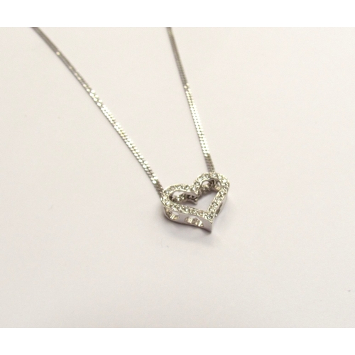 9292 - An 18ct white gold diamond heart pendant hung on a 9ct white gold chain, 40cm long, 3.9g   (R) £700