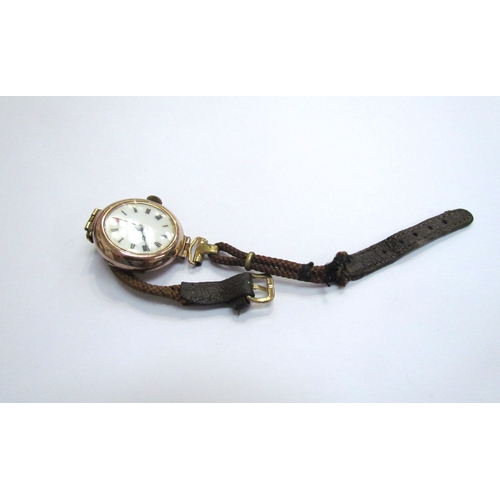 9134 - A 9ct gold cased wristwatch with white enamel dial, on leather strap   (E) £40-60