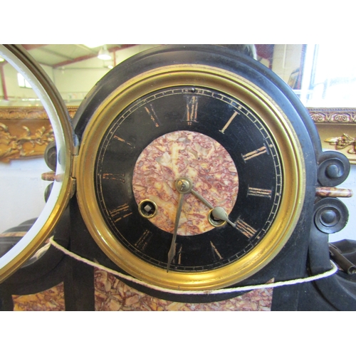 1017 - A slate and marble mantel clock with key and pendulum