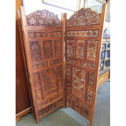 1030 - An Indian carved hardwood five-fold screen with ornate floral panelled design, 147cm tall