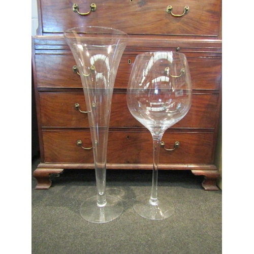 1070 - Two LSA international large scale floor standing glasses, wine glass and champagne flute, with boxes... 