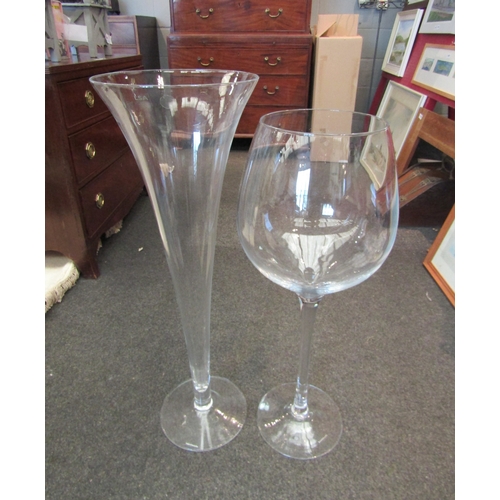 1070 - Two LSA international large scale floor standing glasses, wine glass and champagne flute, with boxes... 