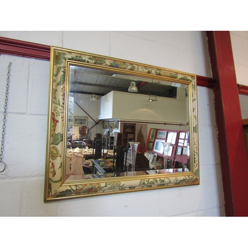 1076 - A decorative foliate wall mirror, 59cm x 74cm