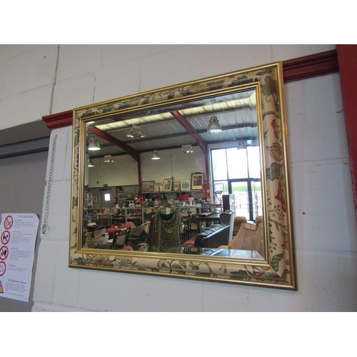 1076 - A decorative foliate wall mirror, 59cm x 74cm