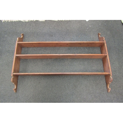 1104 - A pine three tier wall hanging shelf with shaped sides, 92cm tall x 130cm wide