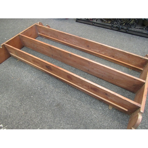 1104 - A pine three tier wall hanging shelf with shaped sides, 92cm tall x 130cm wide