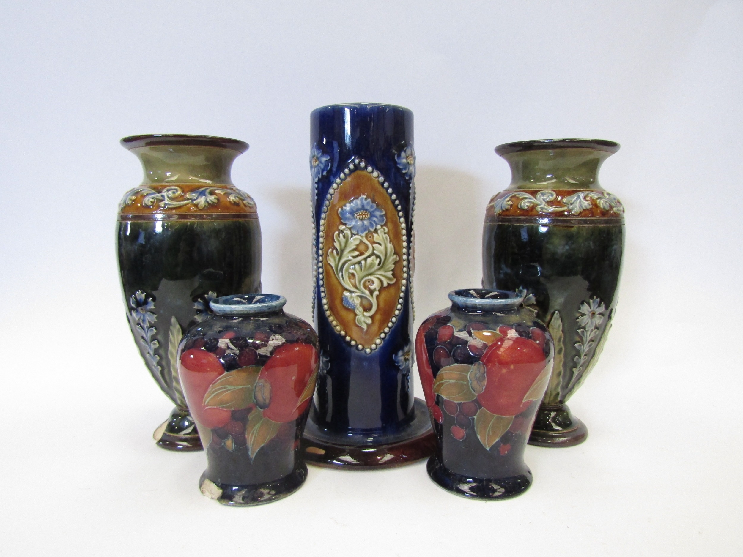 A pair of Royal Doulton Lambeth ware vases, 17cm tall, one a/f, another