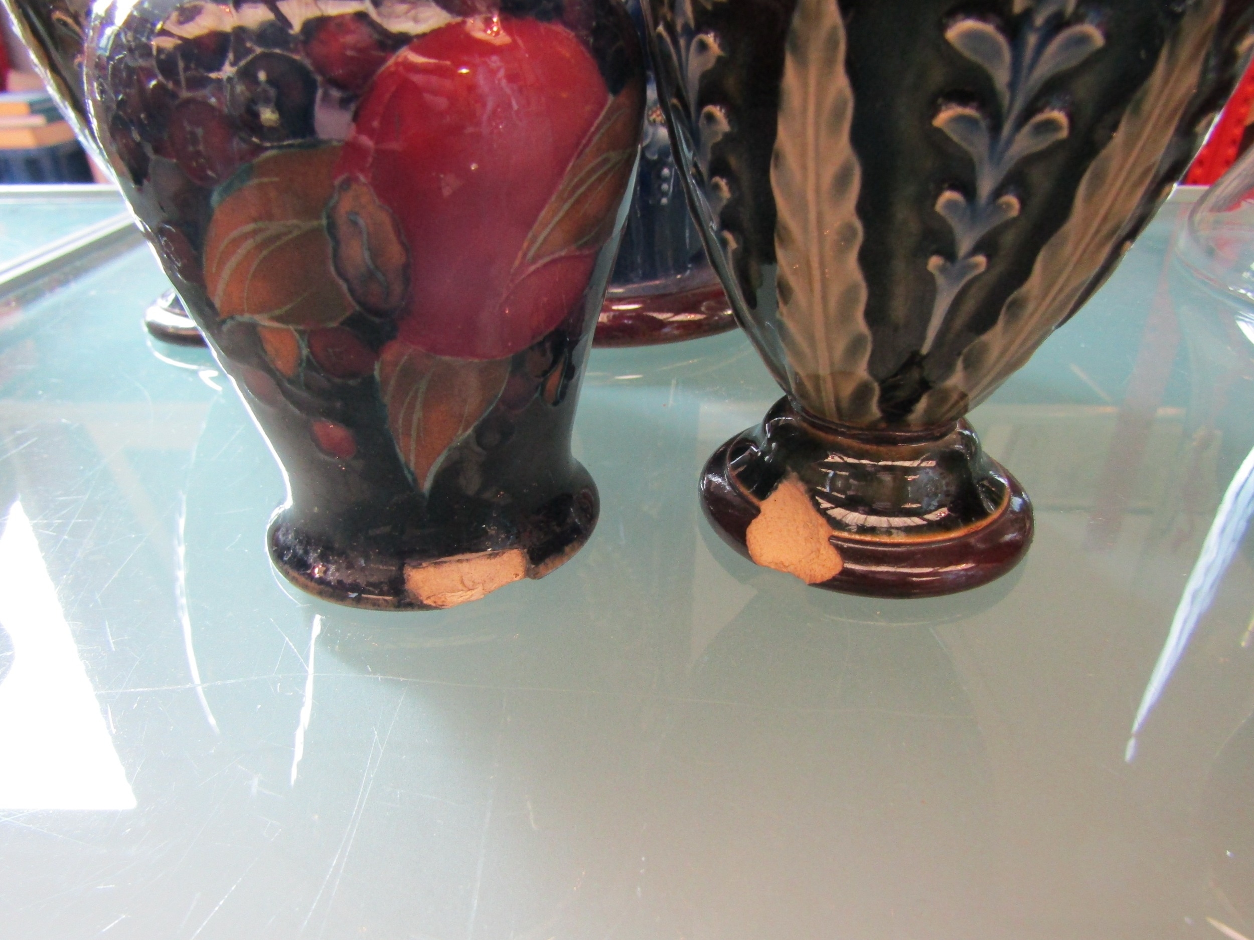 A pair of Royal Doulton Lambeth ware vases, 17cm tall, one a/f, another