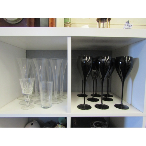 1254 - Ten cut glass champagne flutes and eight Linea wine glasses etc.