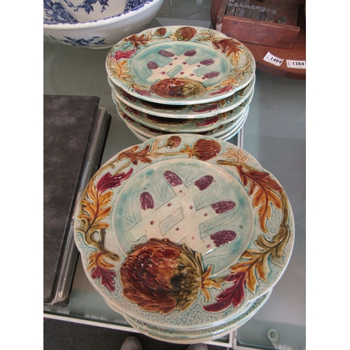 1383 - Twelve Majolica plates and a Spaniel plate