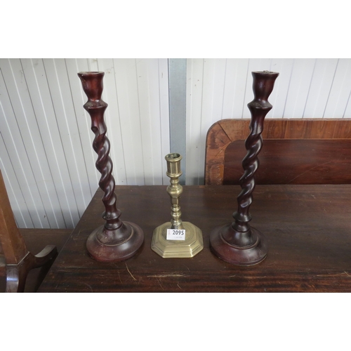 2095 - A pair of barley twist candlestick and single brass candlestick