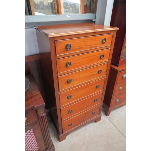 2100 - A 1930s walnut chest of six drawers, ring handles, bracket feet