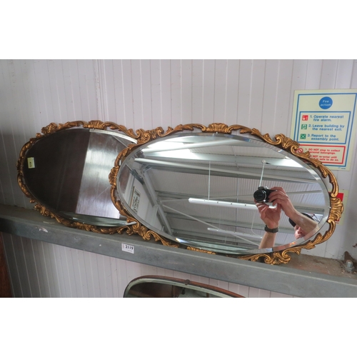 2119 - A pair of gilt oval mirrors   (R) £35