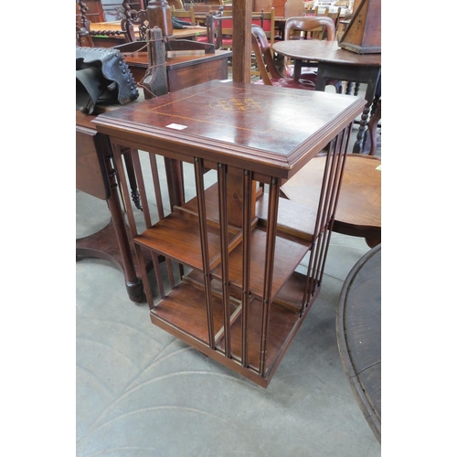 2134 - A Victorian walnut veneer marquetry inlay revolving bookcase