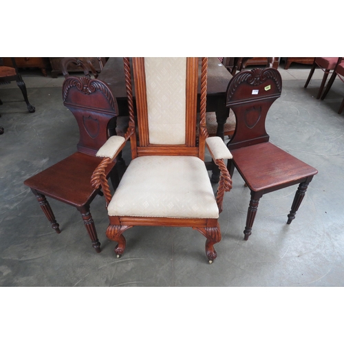 2142 - A pair of mahogany shield back, reeded legged hall chairs, one as seen