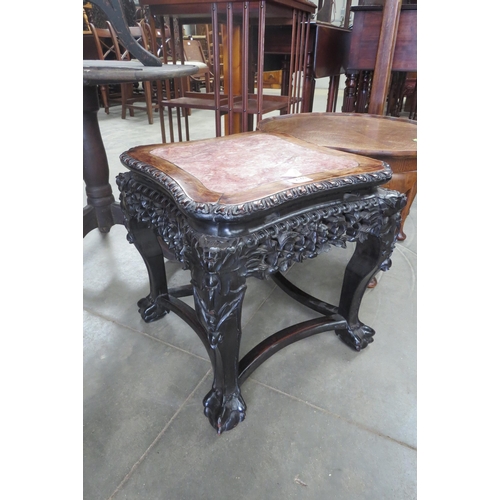 2160 - A late 19th Century, heavily carved, marble topped hardwood Chinese low table on ball and claw feet ... 