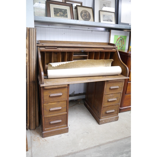 2210 - An oak twin pedestal roll top desk   (E) £10-20