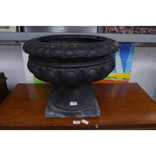 2218 - A fibreglass semi gadrooned urn with egg and dart rim, 40cm tall, 50cm diameter   (R) £50