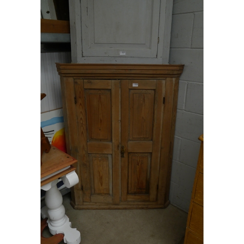 2228 - A stripped pine corner cabinet   (R) £30